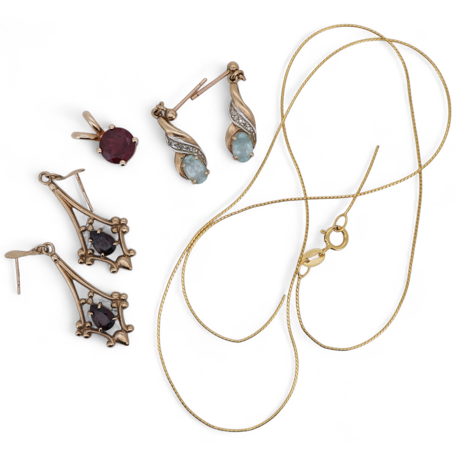 A group of jewels, comprising: a pair of garnet drop earrings; and a broken gold chain, each in 9ct gold, both with British hallmarks; a garnet pendant; and a pair of blue topaz and diamond earrings, each mounted in gold